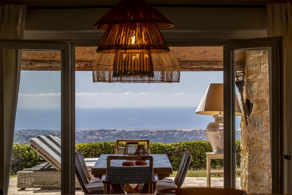 Le Mas des Cimes — The living room and its views over the Mediterranean