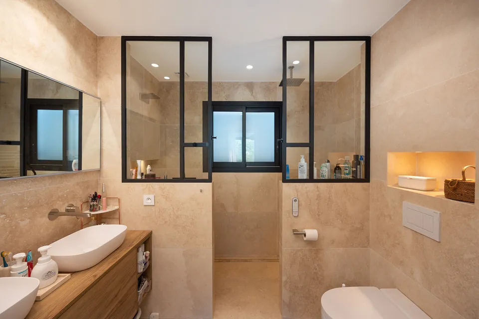 Villa Mélodie — The bathroom and its interior steel-framed glazing