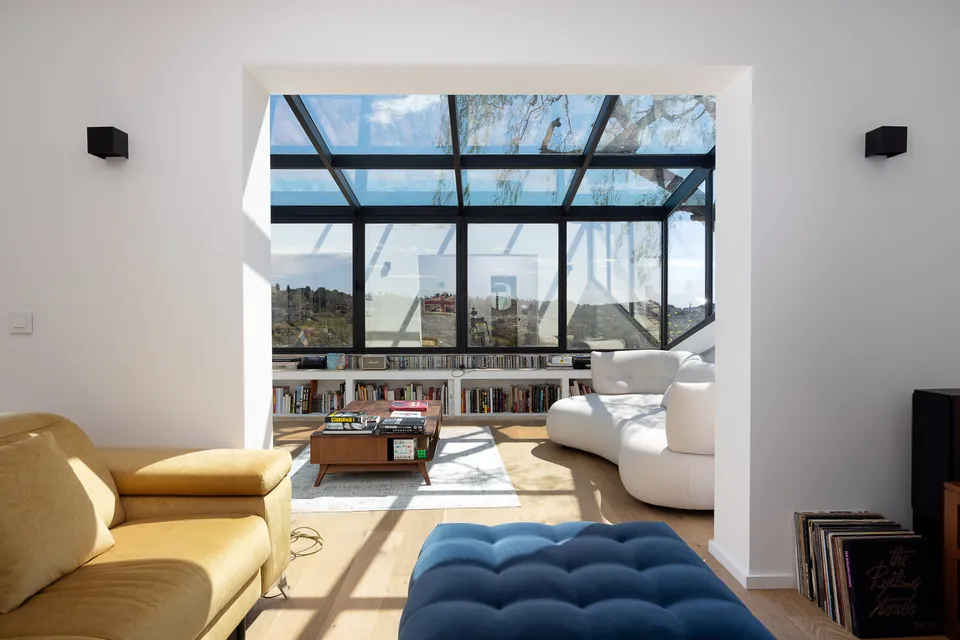 Villa Mélodie — The living room opening onto the steel-framed glazing