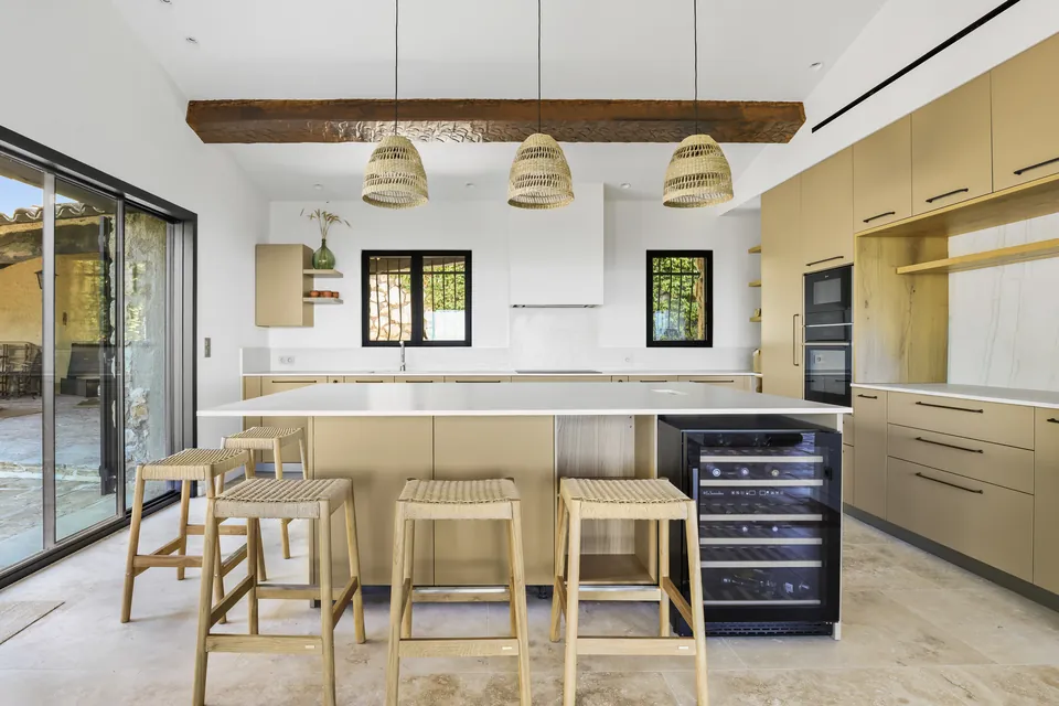 Villa Sola — The kitchen beneath the exposed beams